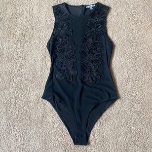 Small black mesh bodysuit tags off but never worn